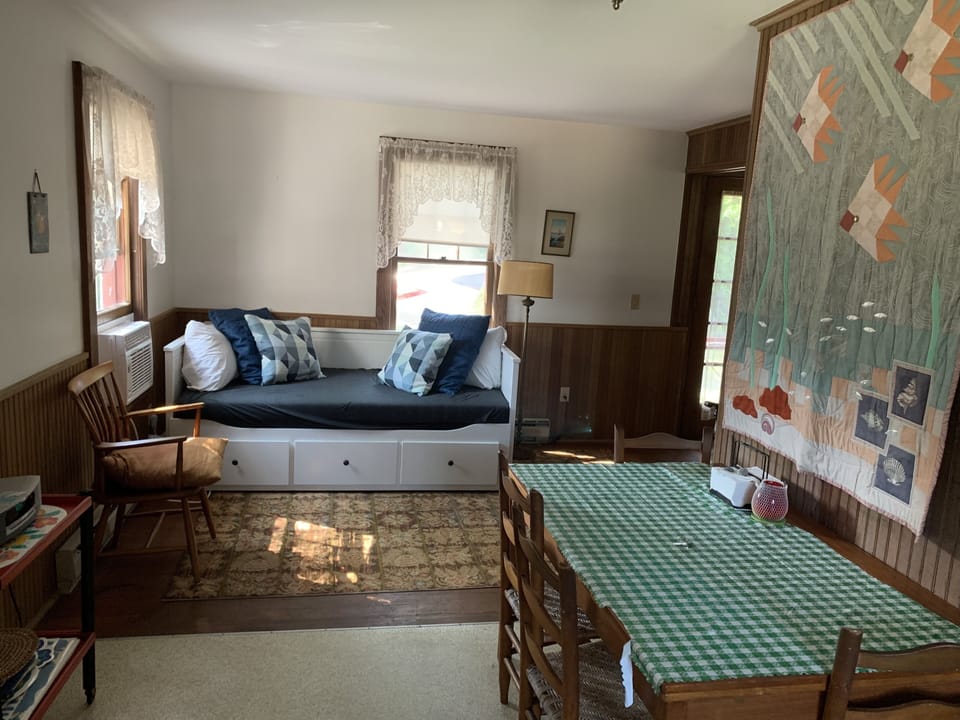 Sitting area off kitchen with day bed, air conditioned