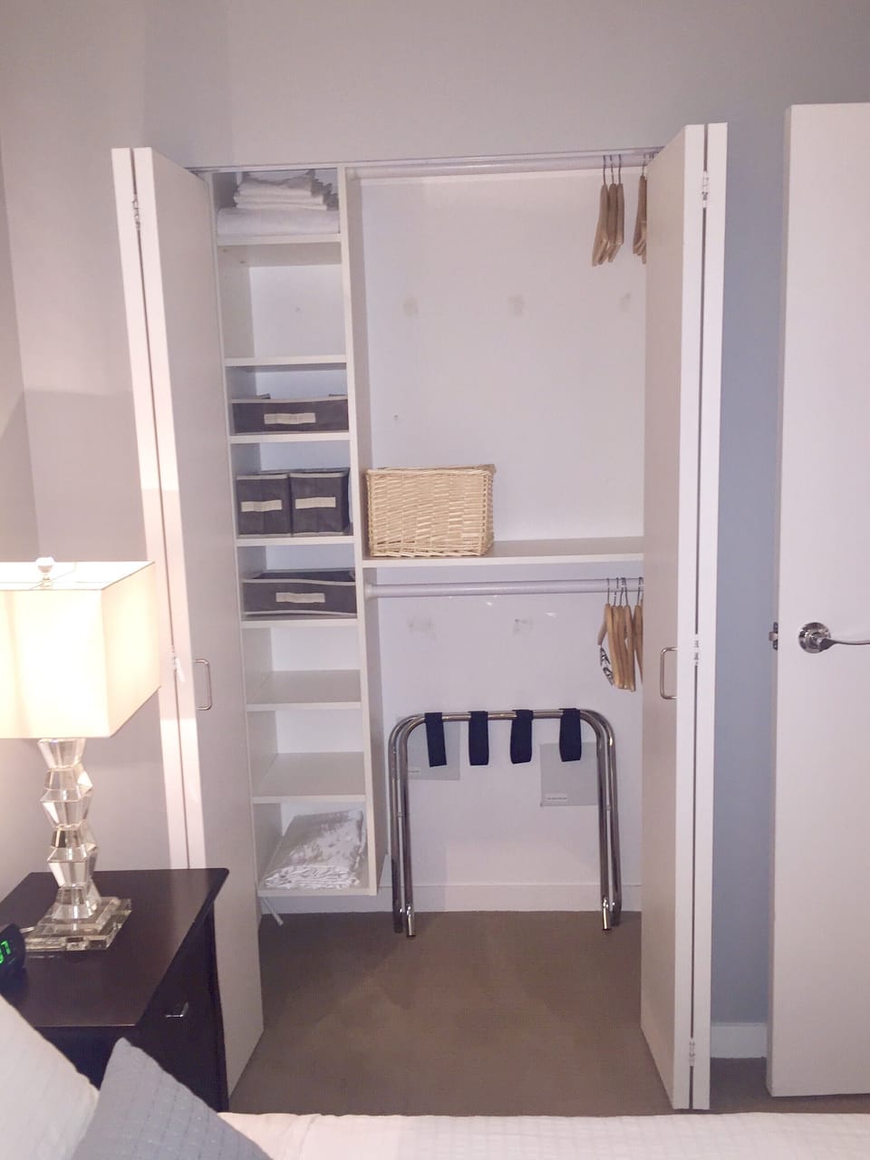 Extra bedsheet stored in the closet; lots of hangers. 