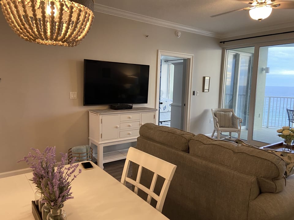 Large flat screen TV to enjoy in the open concept living/dining/kitchen area.