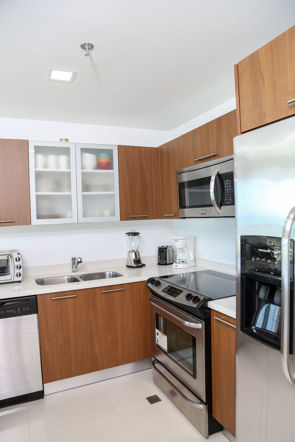 Your fully equipped kitchen features modern stainless-steel appliances, sleek cabinetry, and everything you need to prepare meals during your stay.