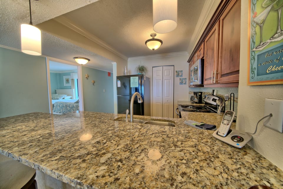 Kitchen with granite and standard appliances