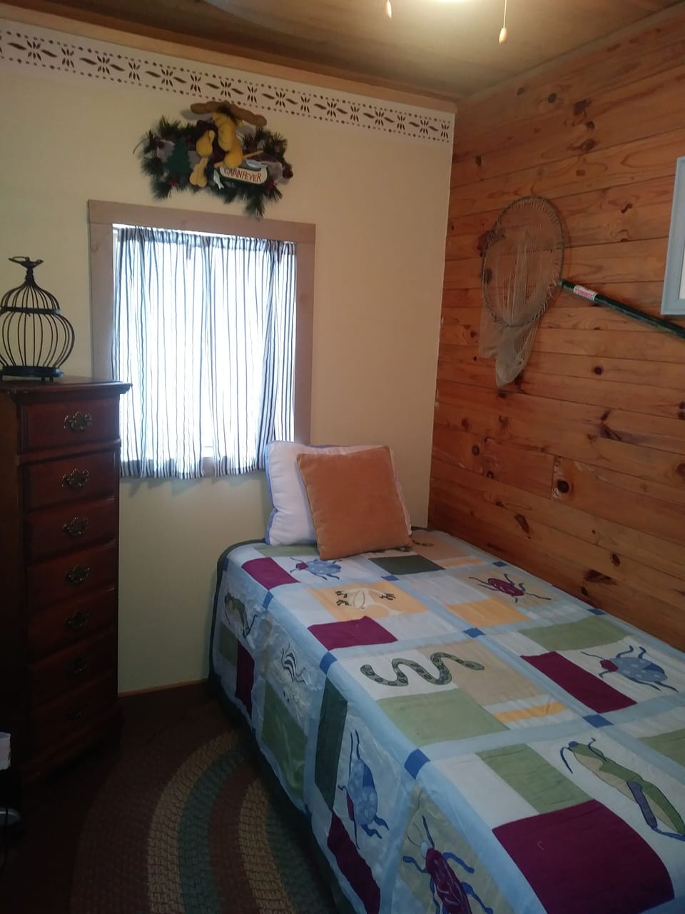 Small bedroom.  Twin bed with traditional mattress