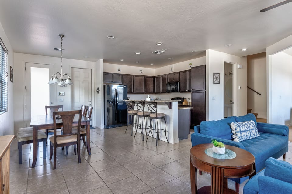 Open concept first floor featuring kitchen, seating area, living room and den.