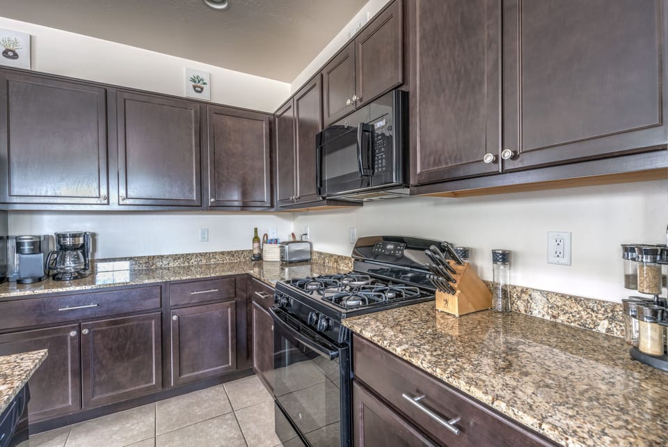 Kitchen features gas stove, microwave and all the essentials.