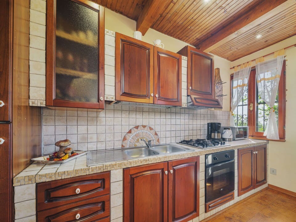 Countertop, Cabinetry, Property, Tap, Sink, Furniture, Building, Kitchen, Wood, Kitchen Stove