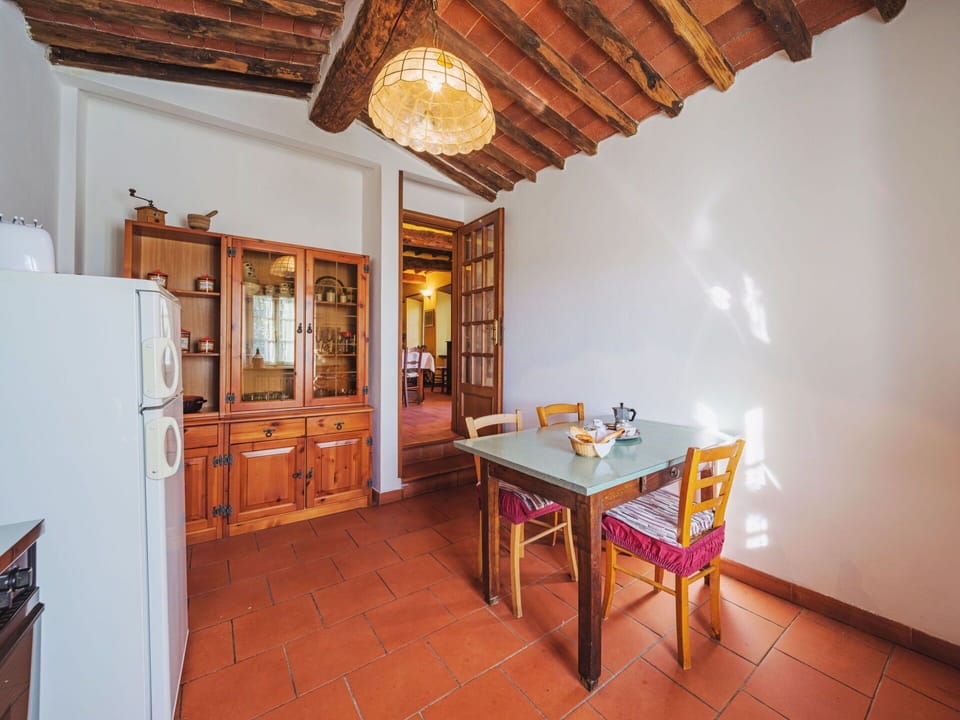 Furniture, Table, Cabinetry, Wood, Building, Orange, Interior Design, Chair, Floor, Wood Stain