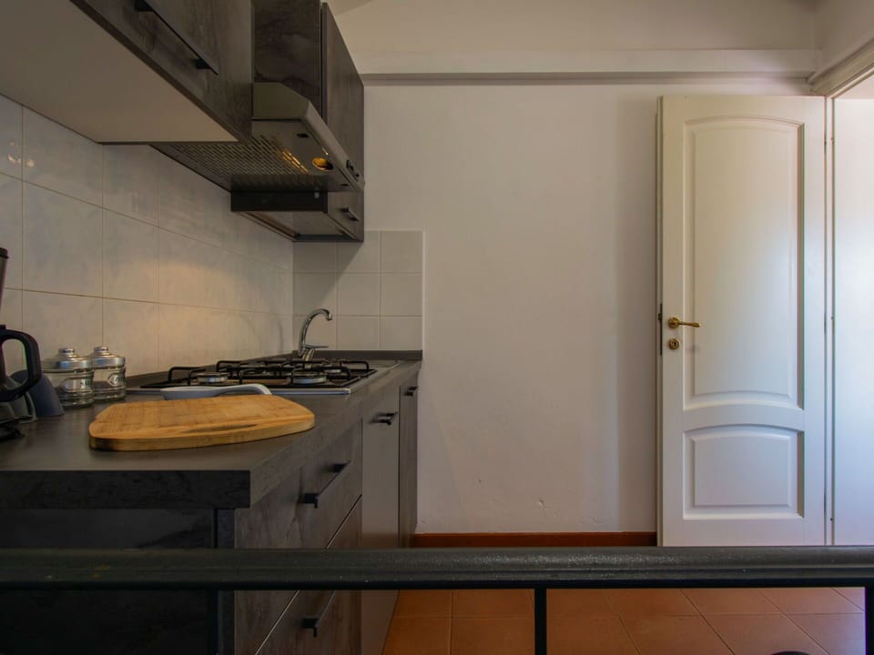 Flooring, Kitchen, Countertop, Wood, Interior Design, Kitchen Appliance, Floor, Major Appliance, Cabinetry, Room