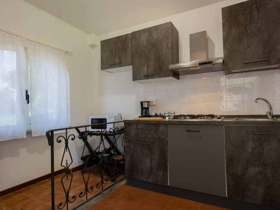 Kitchen, Countertop, Flooring, Furniture, Kitchen Appliance, Interior Design, Floor, Cabinetry, Major Appliance, Room