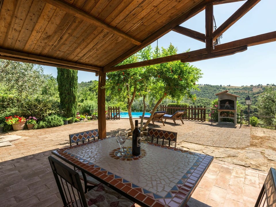 Property, Table, Plant, Shade, Wood, Flowerpot, Interior Design, Building, Outdoor Furniture, Sky