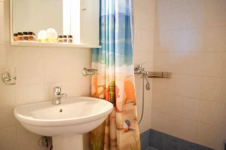 Well-Appointed Bathroom with Tub and Shower