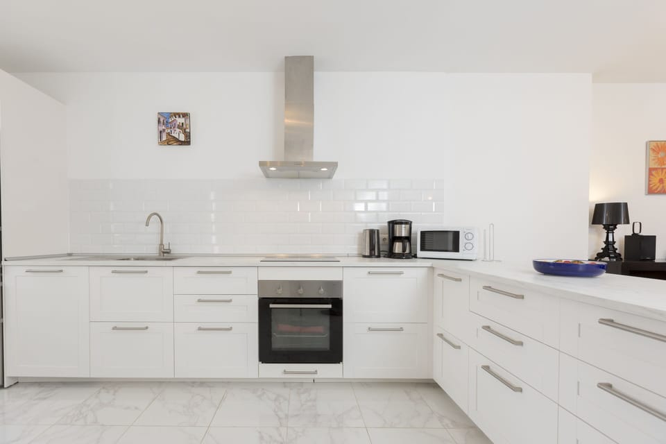 Open kitchen fully equipped with high end appliances