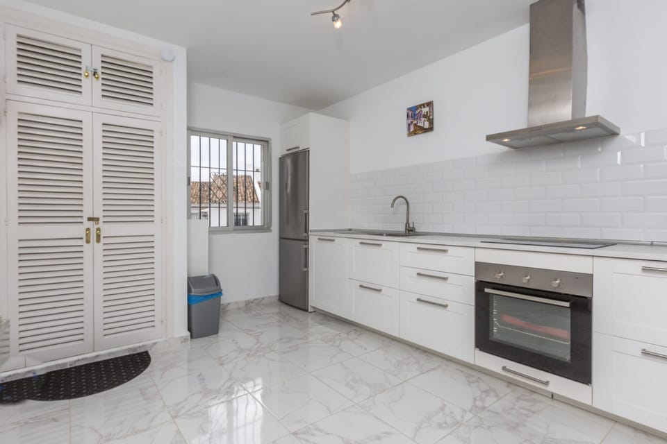 Open kitchen fully equipped with high end appliances
