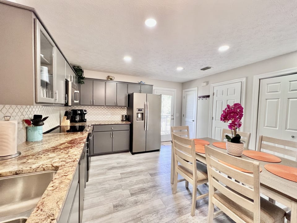 Kitchen area with RO water dispenser. 