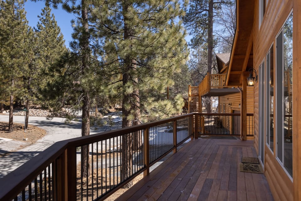 The wrap around deck w/ BBQ, hot tub & 2 (4 seater) tables for alfresco dining. 