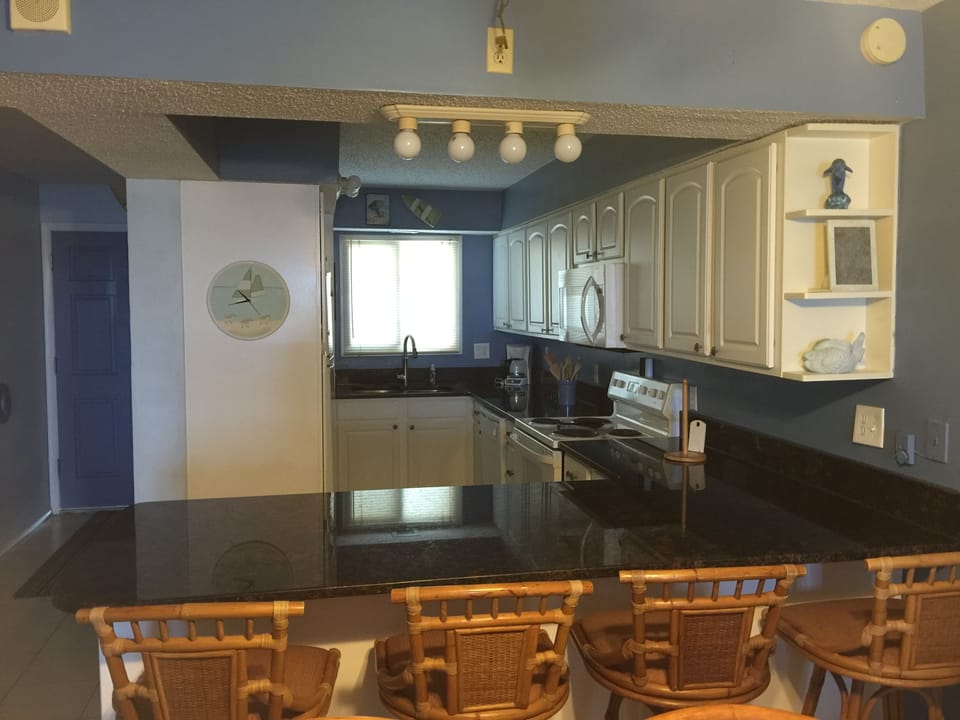 Kitchen has 4 bar stools.  Kitchen has granite counter tops
