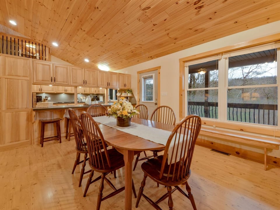 Dining room area with table that extends to seat 16+