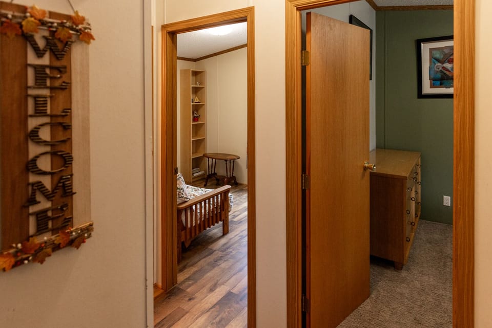 Hallway with 2nd and 3rd bedrooms and a bathroom.