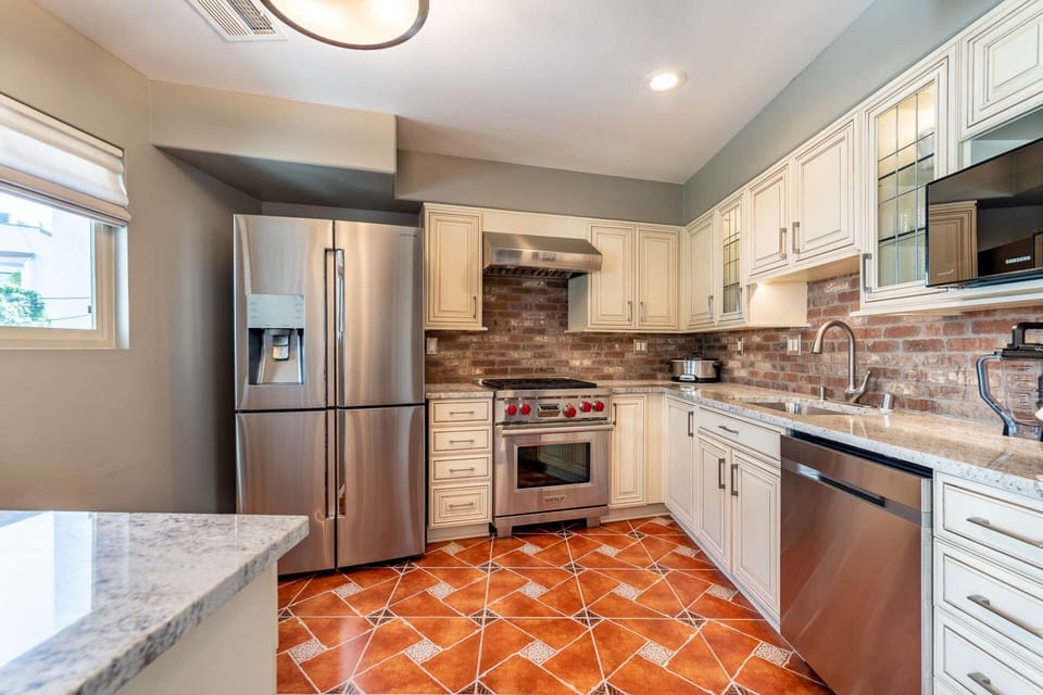 Viking Stove and Oven and large capacity Refrigerator with ice maker and filtered water, plus dishwasher and microwave