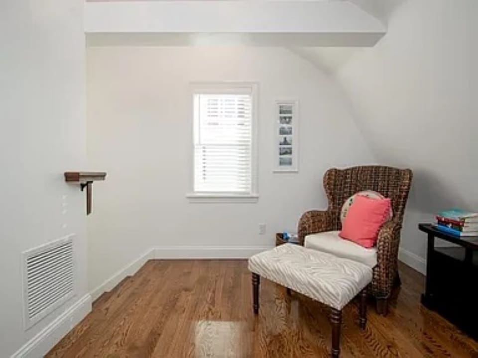 2nd floor sitting area with exposed beams.