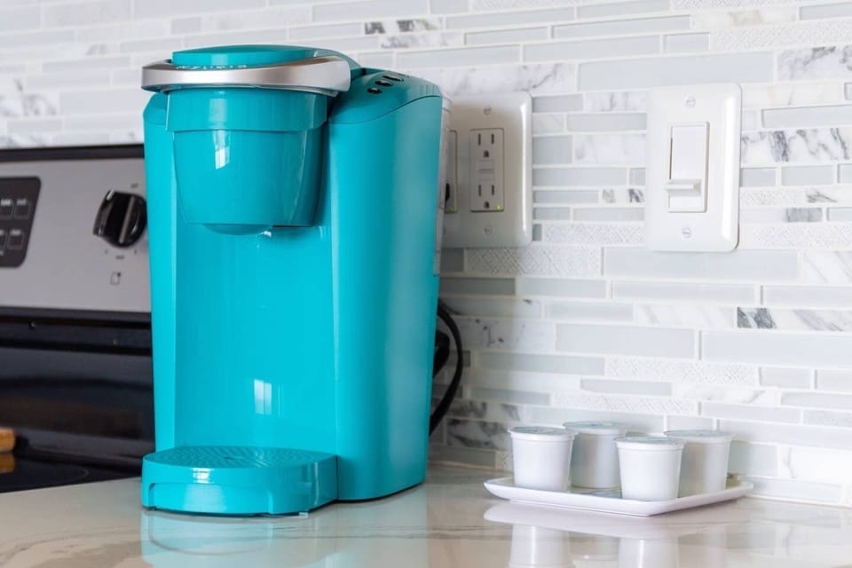 Keurig coffee maker/regular coffee maker with first morning coffee provided.