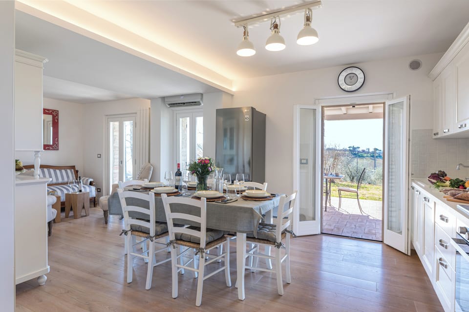 Dining and living area lead to covered patio.
