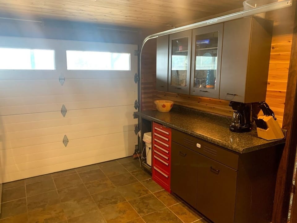 Garage door in the kitchen area that leads to the lower deck.