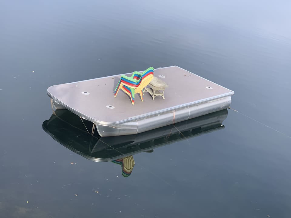 swim up raft, includes a ladder ad chairs for relaxing.