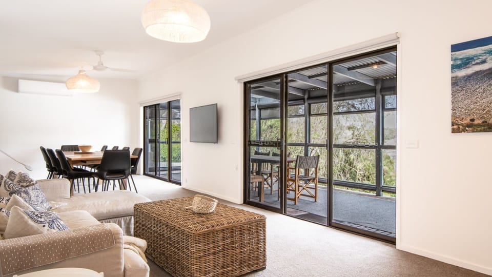 Open plan living dining area with access to the balcony.