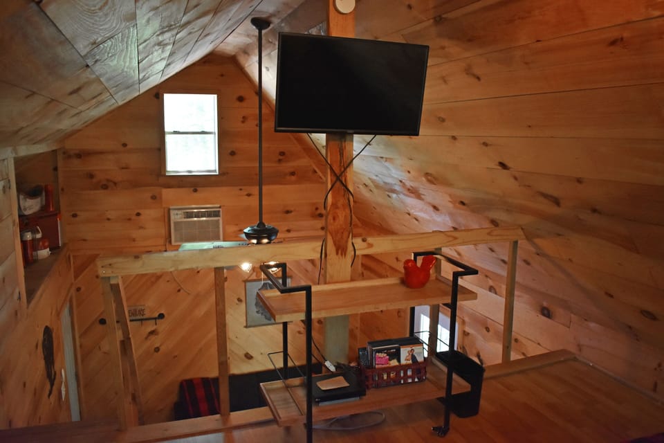 TV in loft. TV does not have cable or satellite reception. DVDs provided.