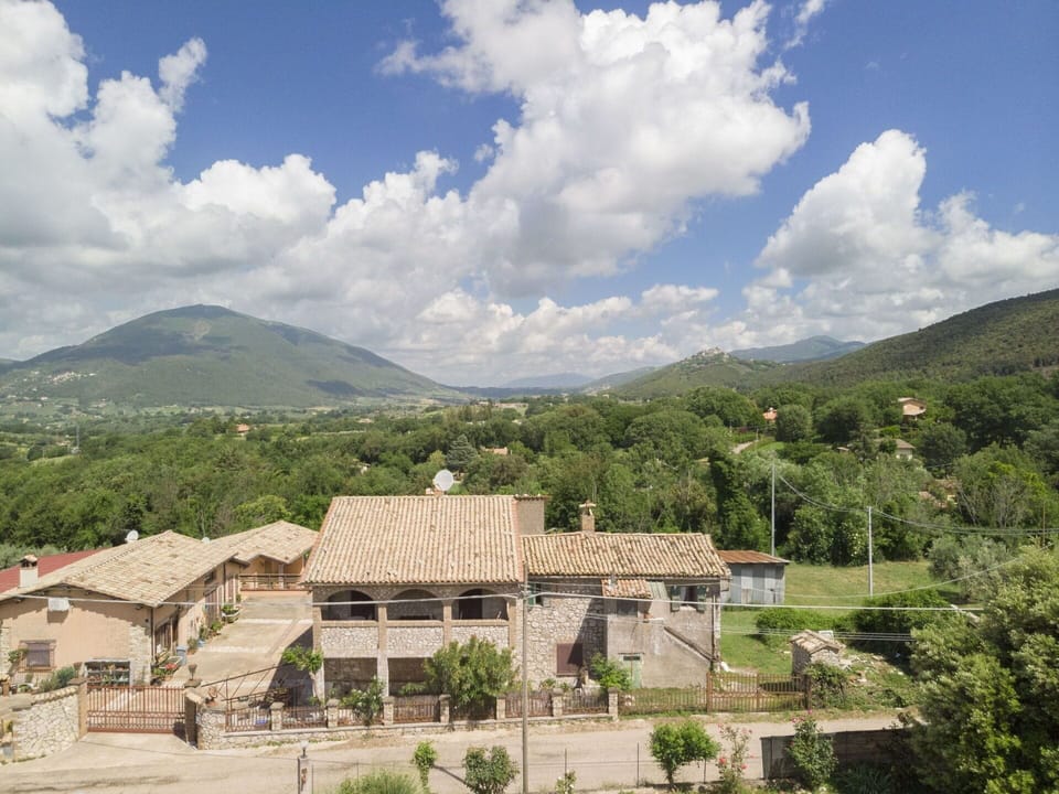 Cloud, Sky, Mountain, Building, Ecoregion, Plant, Highland, Tree, Natural Landscape, Land Lot