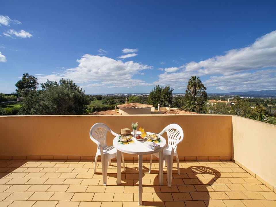 Cloud, Sky, Furniture, Property, Table, Chair, Outdoor Table, Outdoor Furniture, Building, Natural Landscape
