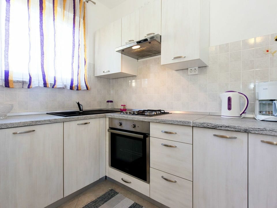 Property, Room, Kitchen, Cabinetry, Furniture, Countertop, Interior Design, Building, Tile, Floor