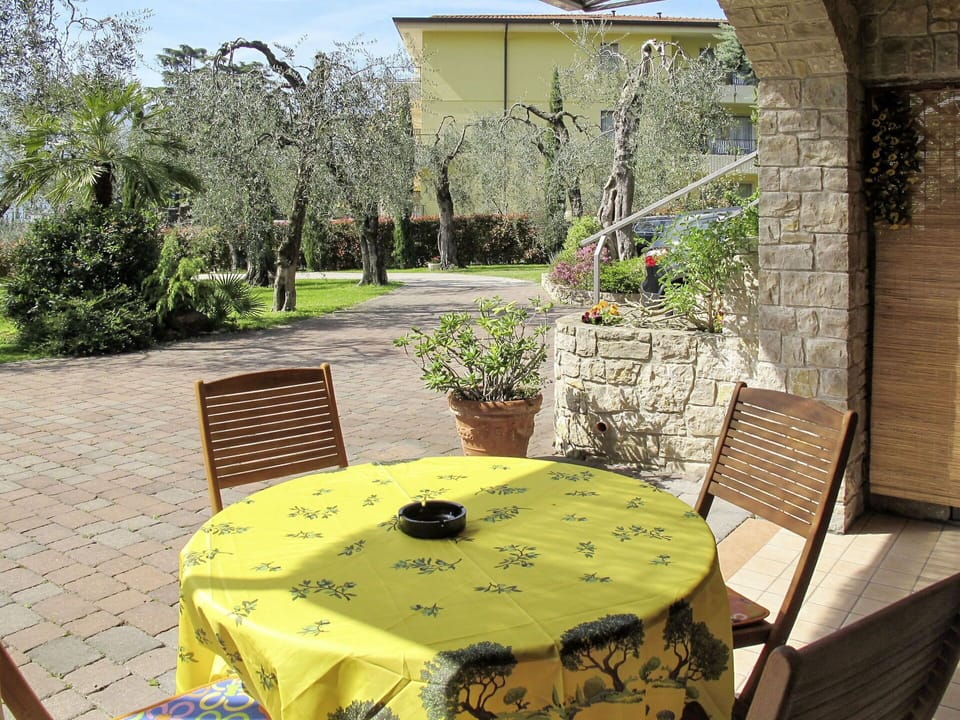 Plant, Table, Furniture, Property, Chair, Building, Flowerpot, Botany, Outdoor Table, Outdoor Furniture