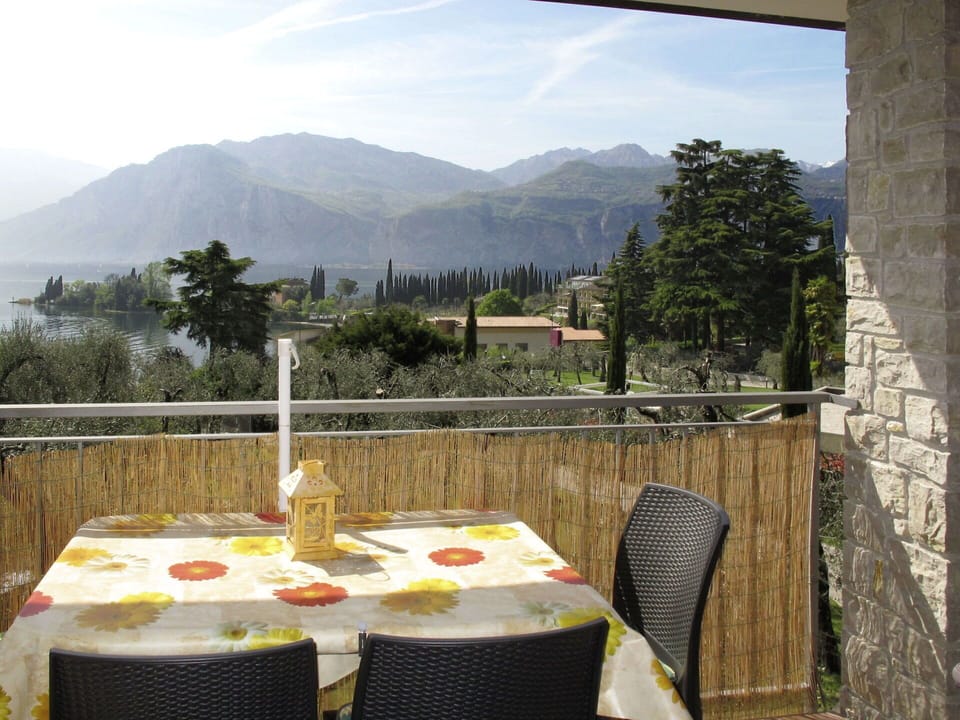 Sky, Table, Cloud, Property, Furniture, Mountain, Tableware, Chair, Tree, Plant