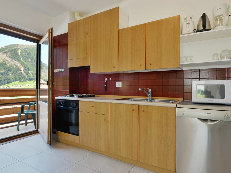 Countertop, Cabinetry, Kitchen, Room, Property, Furniture, Major Appliance, Kitchen Stove, Interior Design, Building