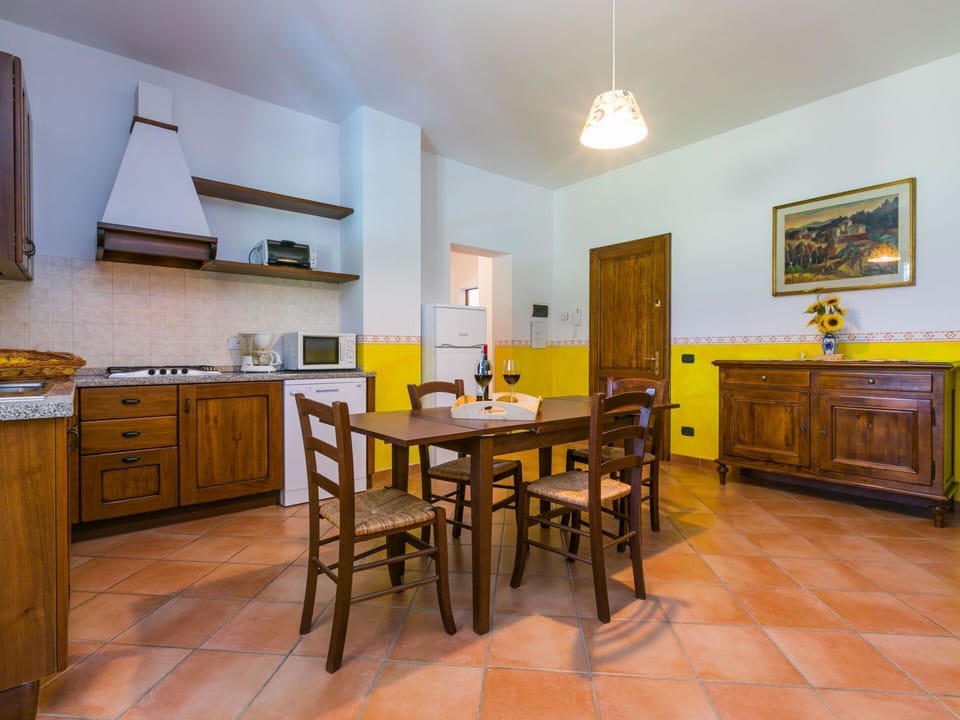 Furniture, Property, Cabinetry, Table, Picture Frame, Countertop, Interior Design, Wood, Lighting, Kitchen