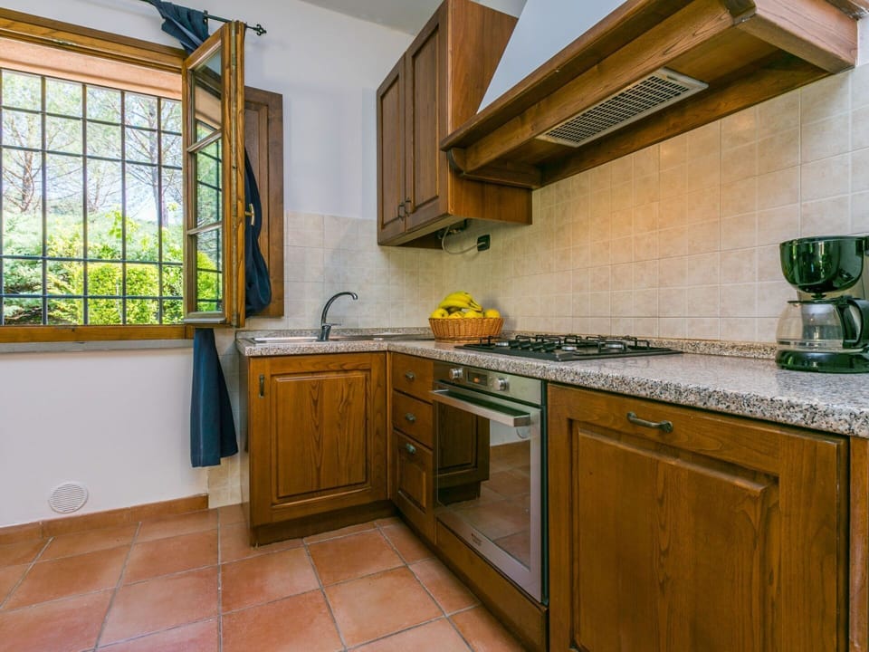 Cabinetry, Countertop, Property, Kitchen Sink, Kitchen Appliance, Kitchen, Kitchen Stove, Window, Wood, Home Appliance