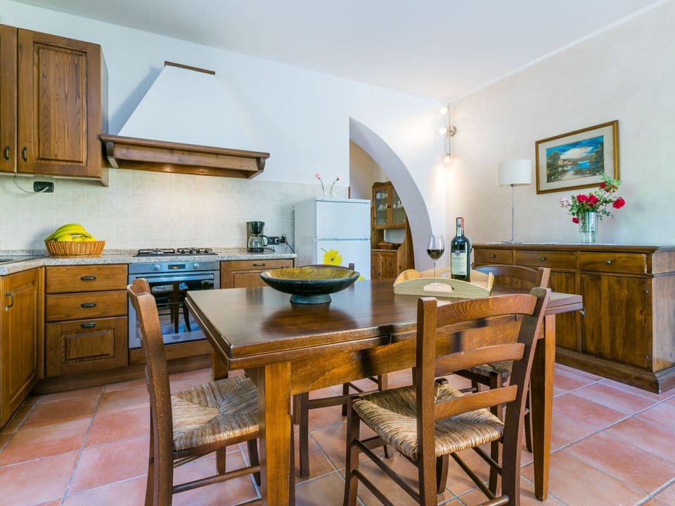 Furniture, Table, Property, Cabinetry, Chair, Wood, Interior Design, Countertop, Kitchen Appliance, Picture Frame