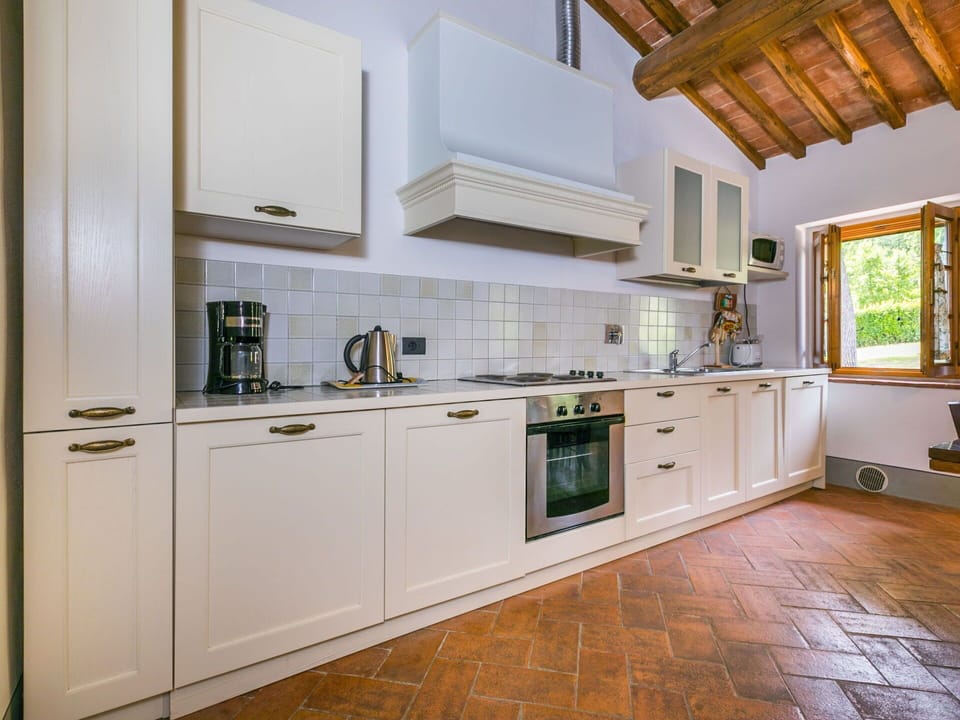 Cabinetry, Countertop, Property, Building, Kitchen Appliance, Kitchen Stove, Wood, Interior Design, Kitchen, Lighting