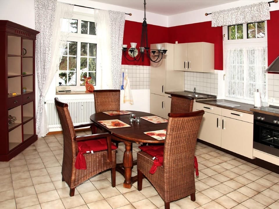 Dining room with open kitchen overlooking the garden