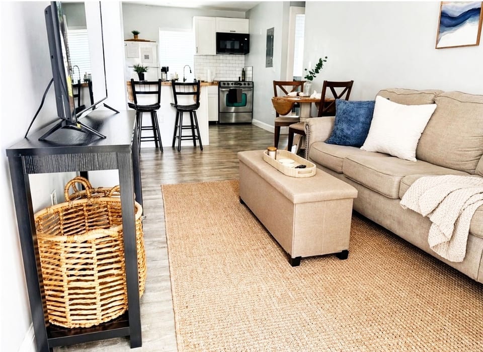 Living area looks into open kitchen