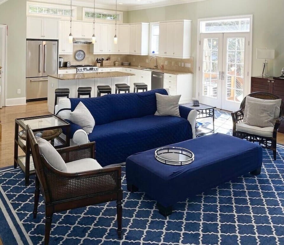 Kitchen features Jenn Air stainless steel appliances & large granite island. 