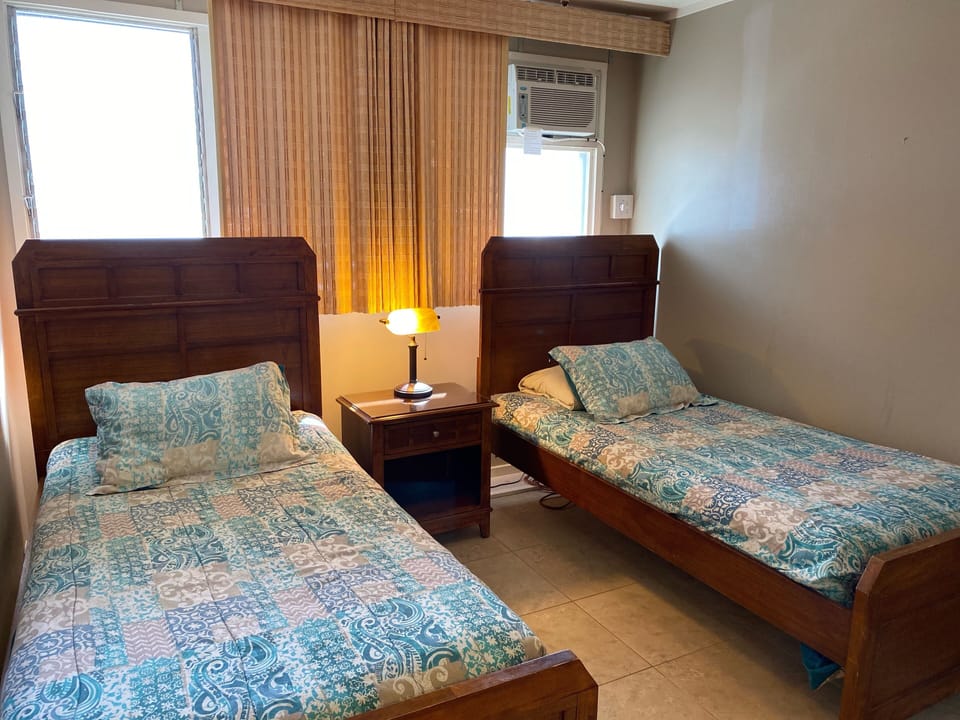 Second bedroom with two single beds that can be converted into a king bed.