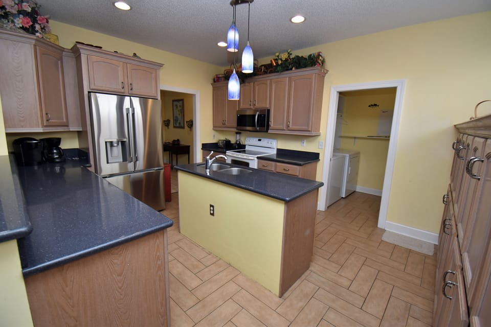 Laundry room with full size washer & dryer.