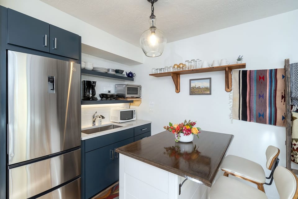 The kitchenette provides a coffee maker, kettle, hot plate, convection oven/toaster, Vitamix and other basic cooking tools.