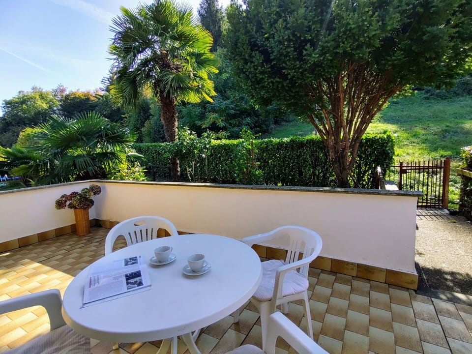 Table, Plant, Furniture, Property, Outdoor Table, Tree, Chair, Building, Sky, Outdoor Furniture
