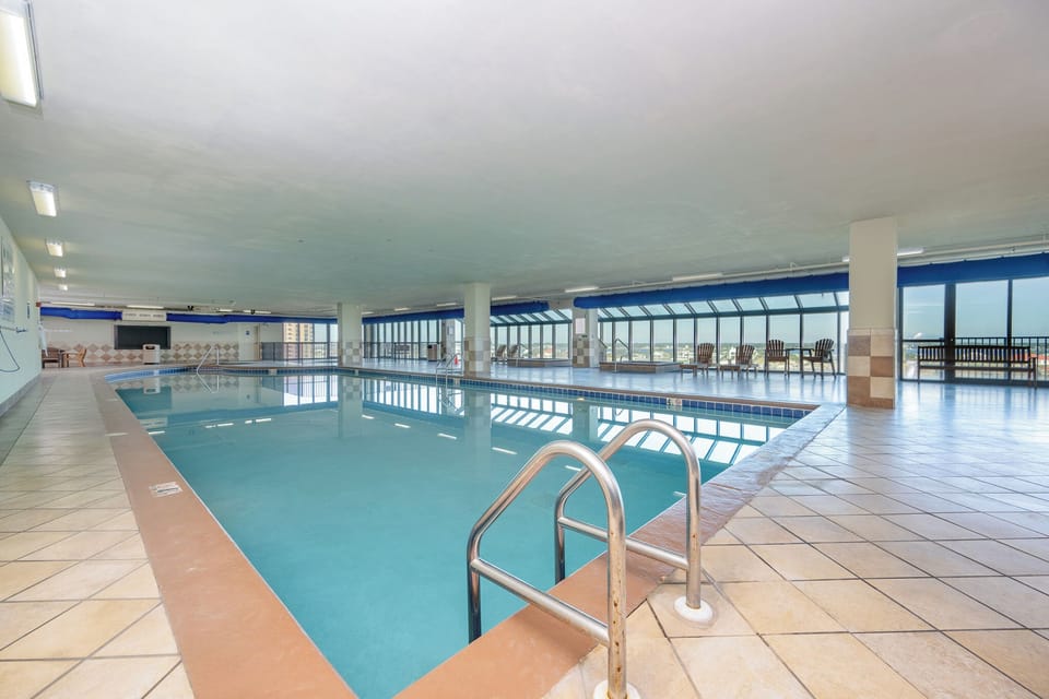 Dip into relaxation at the Phoenix IX indoor pool with stunning views, perfect for a refreshing swim or lounging by the water