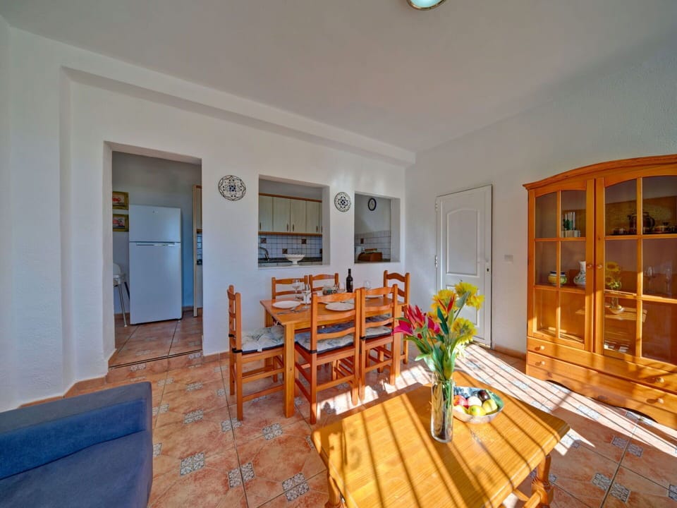 Property, Table, Cabinetry, Building, Wood, Interior Design, Orange, Lighting, Chair, Flooring