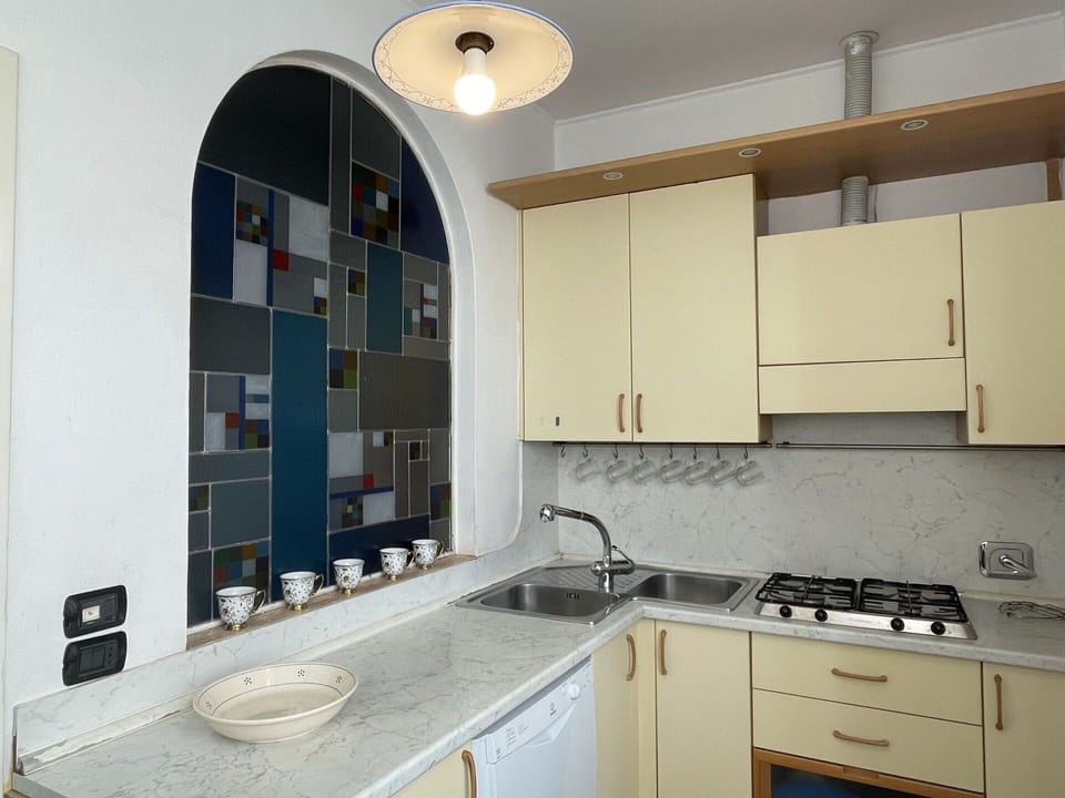 Table, Furniture, Property, Countertop, Tableware, Cabinetry, Food, Plant, Window, Chair