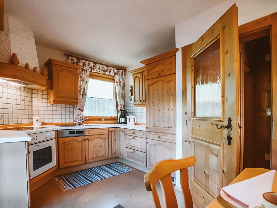 Cabinetry, Property, Furniture, Countertop, Kitchen, Wood, Interior Design, Wood Stain, Floor, Kitchen Appliance